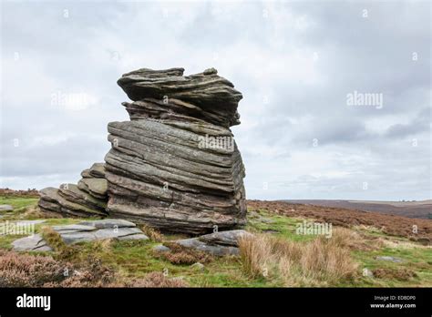 Mother Cap, a gritstone rock formation on Hathersage Moor, Peak District National Park, England ...