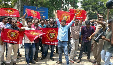 Activists of Naam Thamilar Katchi display banner and shout slogans ...