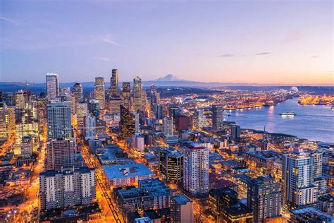 Space Needle view of Downtown Seattle, Elliott Bay & Mount Rainier | Explorest