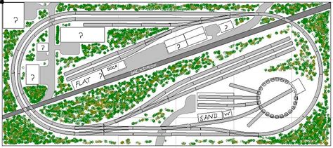 an aerial view of a train track with trees