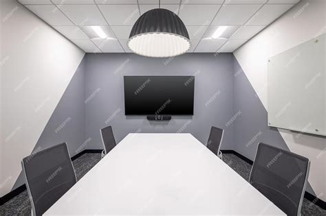 Premium Photo | Conference Room With Wall Mounted Screen