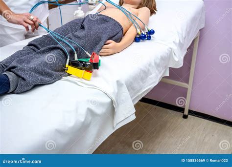 Nurse is Preparing a Child, Teenager Patient for ECG or EKG Test Stock ...