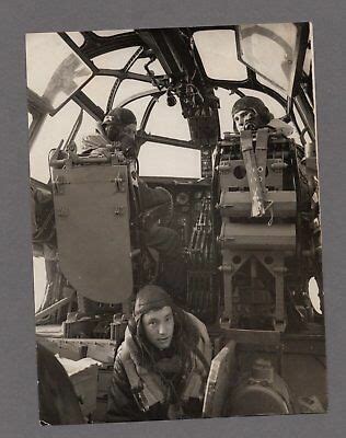 an old black and white photo of some people in the cockpit of a plane ...