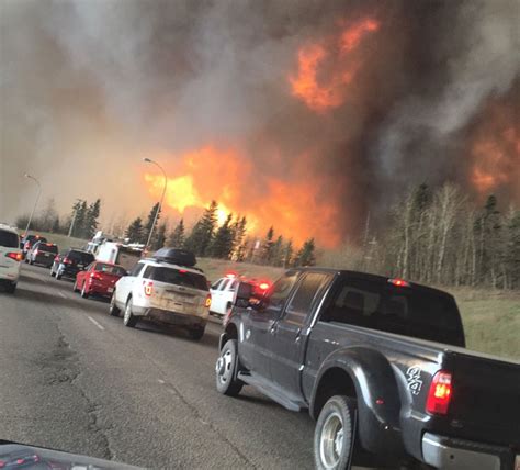 Oilsands firms halt production, take in evacuees as wildfires rage in Fort McMurray, Alta ...