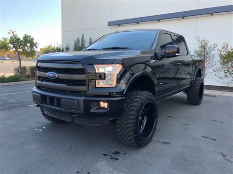 clean 2015 Ford F 150 Lariat pickup lifted for sale