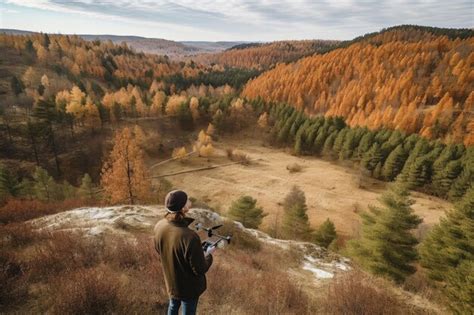 Premium AI Image | Shot of a young man using a drone to take photos of ...