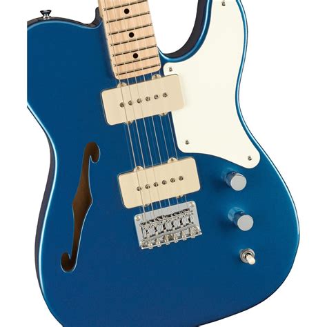 an electric guitar with blue body and white neck