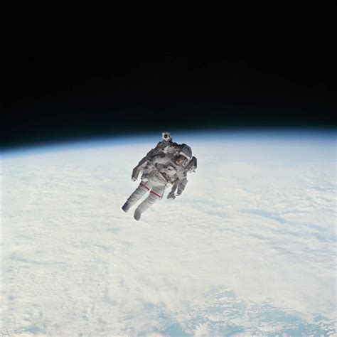 Astronaut Robert Stewart untethered above the Earth during Manned ...