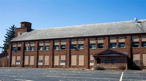 Cases of donated water found inside old Flint school