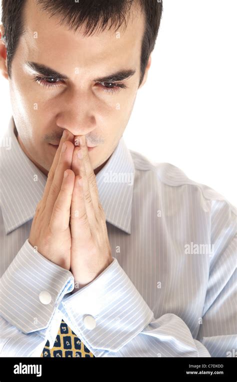 Isolated young business man pray Stock Photo - Alamy