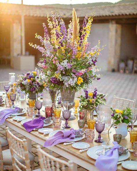 Beautiful outdoor wedding decoration with purple and yellow details! See more ideas… | Yellow ...