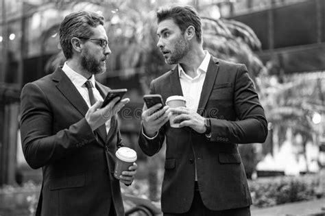 Photo of Shocked Business Men with Phone at Coffee Break. Business Men with Phone at Coffee ...