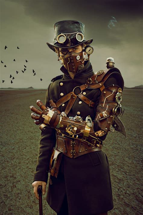 a man dressed in steampunk clothing and holding a cane with birds ...