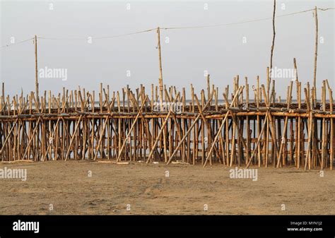 Bamboo bridge over the River Mekong. The longest bamboo road bridge in the world. A closeup of ...