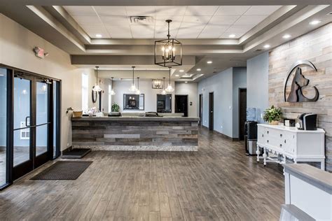 a large room with wooden floors and white walls