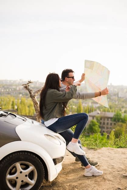 Free Photo | People navigating with map on a road trip