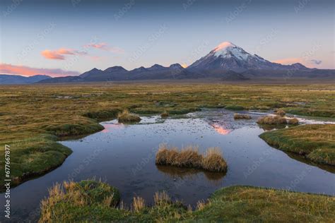 View of Nevado Sajama, an extinct stratovolcano with snow on top, Sajama National Park, Bolivia ...