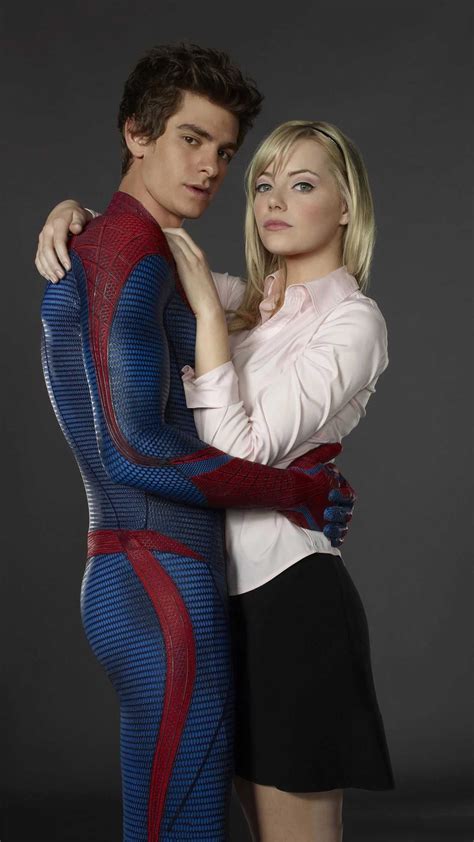 the amazing spider - man and woman are hugging