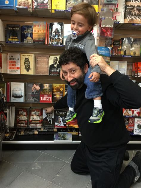 Rabbi Cahn and his youngest son, Dael, take a moment to point out his book in the airport ...