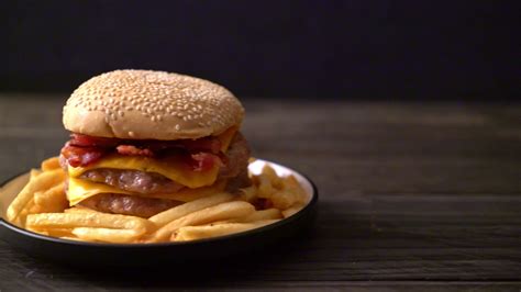 Pork burger with cheese and bacon 3104626 Stock Video at Vecteezy