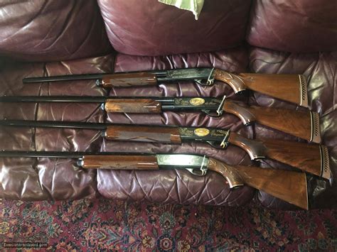 SET OF 4 REMINGTON SHOTGUNS