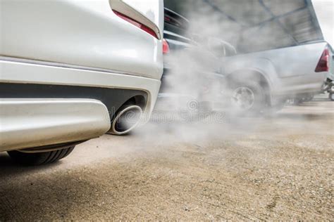 Combustion Fumes Coming Out Of White Car Exhaust Pipe, Air Pollution Concept Stock Photo - Image ...