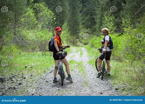 Two Womens on Bikes in Spring Forest Stock Image - Image of bush, outdoors: 4869785