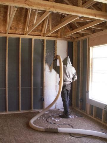 Blown fiberglass insulation fills netted wall cavities | Building ...