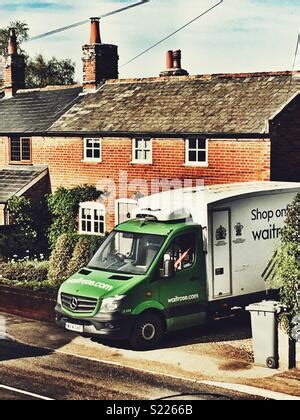 Waitrose supermarket delivery van parked in the car park in Cirencester, Gloucestershire, UK ...