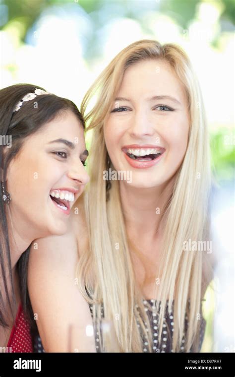 Women laughing together Stock Photo - Alamy