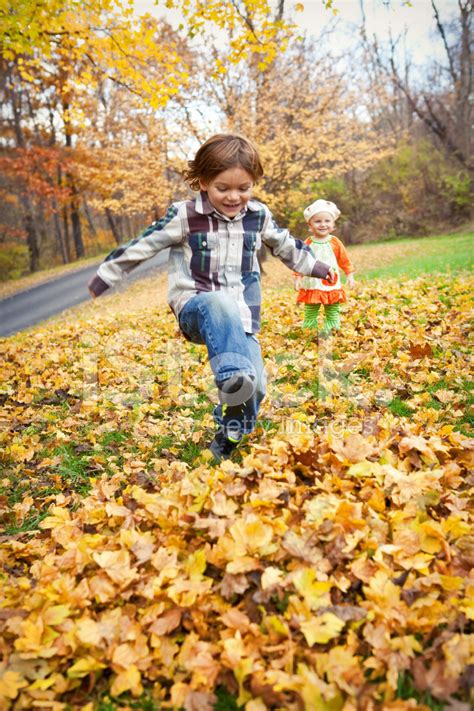 Children Playing IN Fall Leaves Stock Photos - FreeImages.com