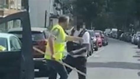 Shocking moment screaming driver attacks traffic warden after he took photos of his van in ...