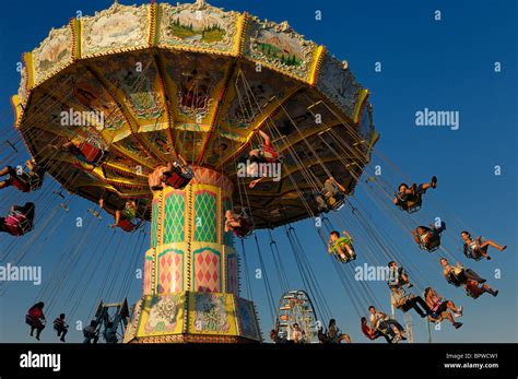 Children on the classic spinning swing ride at sunset at the Toronto CNE Stock Photo - Alamy