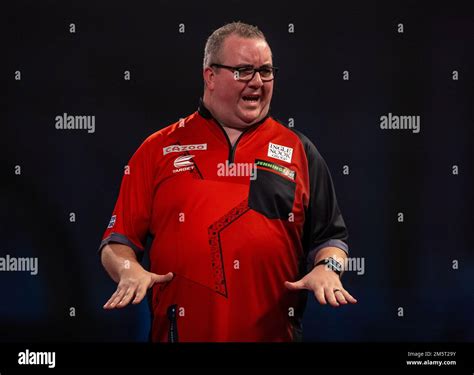 Stephen Bunting reacting during day thirteen of the Cazoo World Darts Championship at Alexandra ...