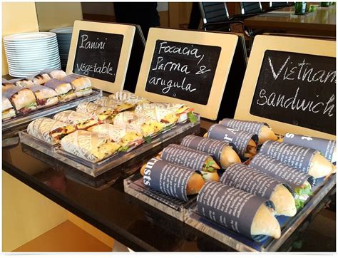 Get creative with pre-packaged sandwiches, which can be carried away and eaten if attendees are ...