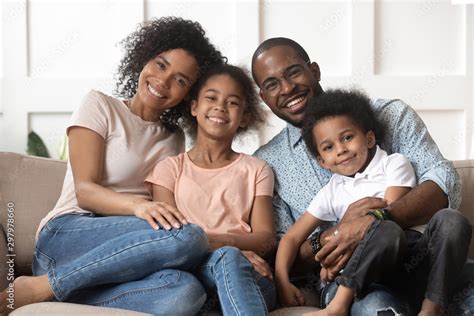 Portrait of black family with kids relax on couch Stock Photo | Adobe Stock