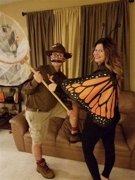 a man and woman dressed up as monarch butterflies