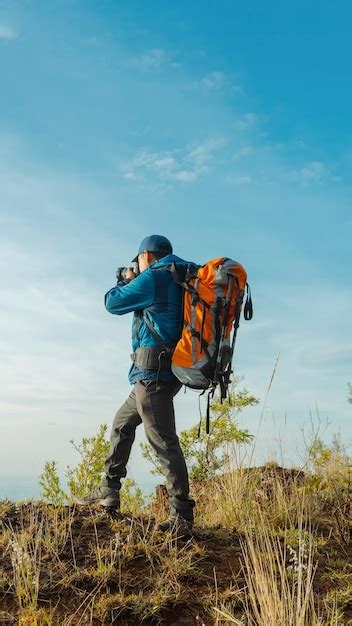 Premium Photo | Hiker traveler immersed in photography