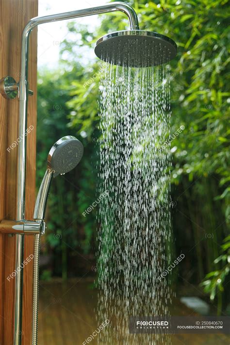 Close-up view of shower with falling water and green natural background — clean, bath - Stock ...