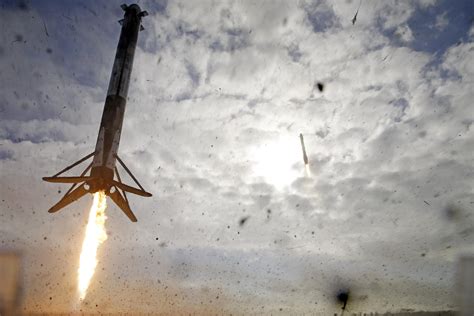 SpaceX nails booster landings after foggy military launch | AP News