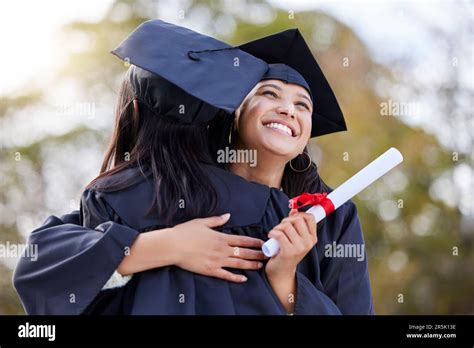 Graduation, education and woman friends hugging at a university event on campus for celebration ...