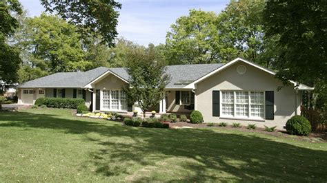 Home modifications for a young family's ranch involved a new two-car garage, porch addition and ...