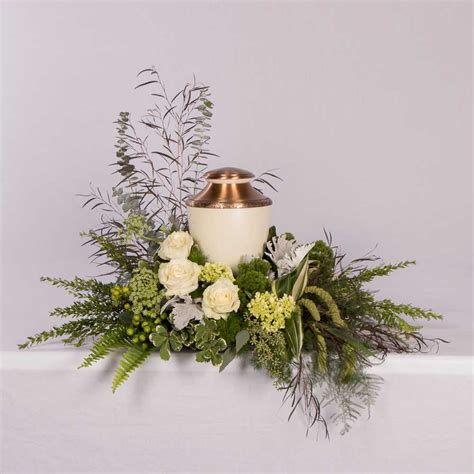 Green and white Cremation Urn by Floral Art Designs