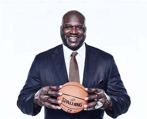 Shaq Holding Things