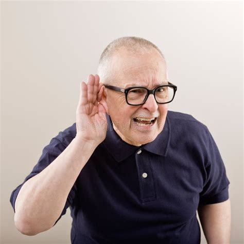 Man cupping his ear stock photo. Image of hearing, adult - 6599344