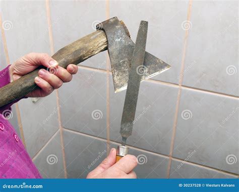 Sharpening an axe 2 stock photo. Image of hand, blade - 30237528