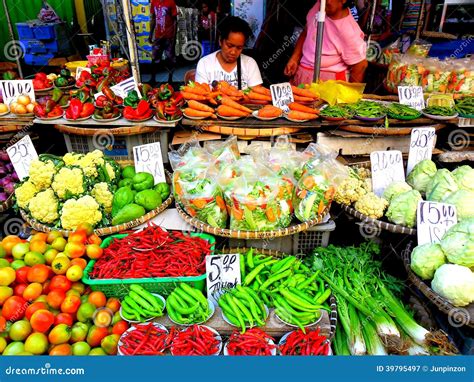 Asian Street Vendor Selling Fruits And Vegetable In Quiapo, Manila ...