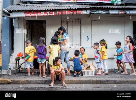 Young Filipino children play in the street in the old walled city of ...