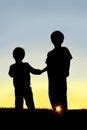 Free Stock Photo 9487 silhouette kids holding hands | freeimageslive