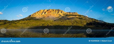 Sunrise on Lake with Bear To Butte in the Background, Montana Stock ...